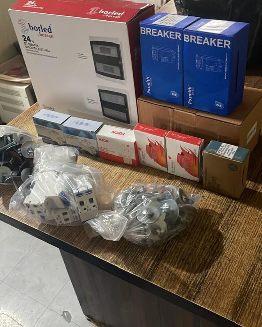Breaker boxes, changeover hardware and fixings laid out before an install.